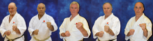 technical committee, four men in white karate suits